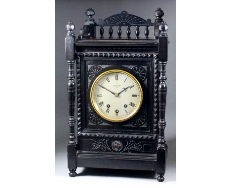 A late 19th Century German ebonised mantel clock retailed by John Walker, 77 Cornhill, London, the 5.75ins diameter silvered 