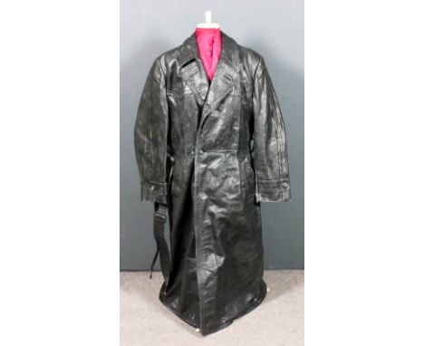 A 20th Century German heavy leather trench coat bearing makers label for Hohenstein, dark green leather finish, dark green co
