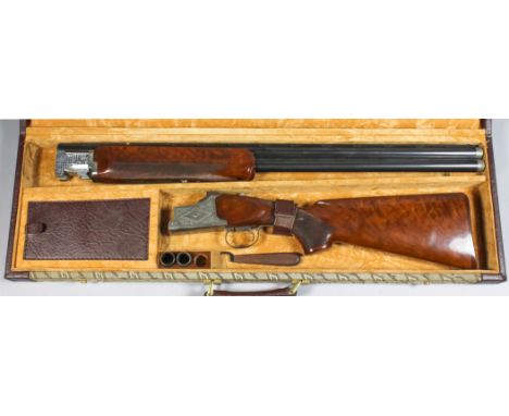 A good 12 bore over and under shotgun by Winchester, model "Diamond Grade" Serial No. 467559, the 28.5 blued steel barrels wi