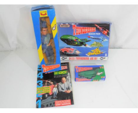 Thunderbirds - Pelham, Matchbox and others - three Thunderbirds related items and ephemera, including a boxed 1992 Pelham Thu