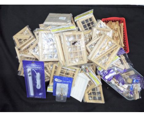 Dolls House  - a good collection of new and in packed dolls house items  to include a large amount of casement windows by the
