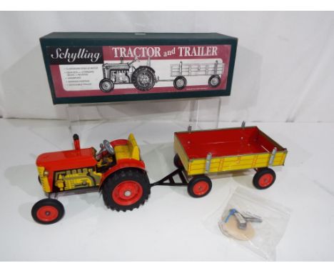Schylling - a tinplate and clockwork Tractor and Trailer, tinprinted detailed model with key in original labelled all card bo