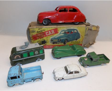 Die cast by Dinky and others together with a Chad Valley clockwork saloon, boxed.