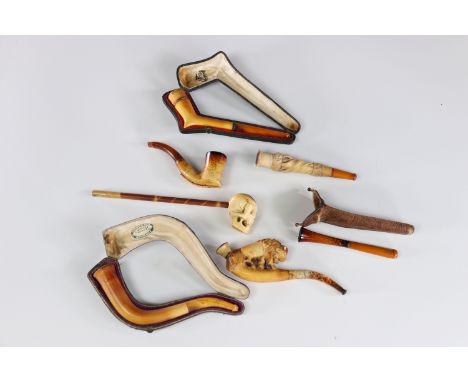 Lot of 7 amber and foam pipes and cigarette smokesSizes: diversWeight (K): 0.180kg