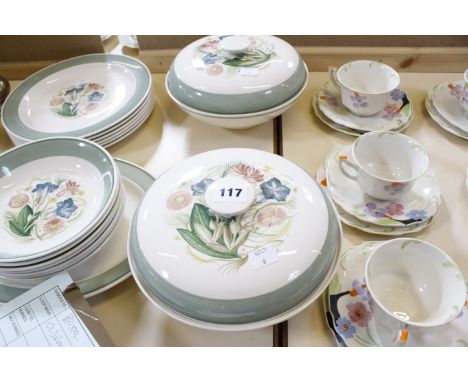 A Susie Cooper part dinner service, green border and floral decorated, to include dinner plates, bowls and tureens, a Susie C