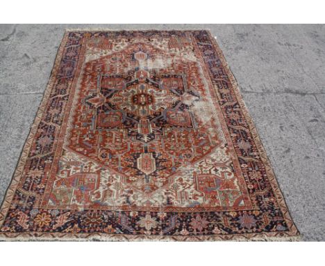 An antique Persian Heriz carpet 309 x 224cm