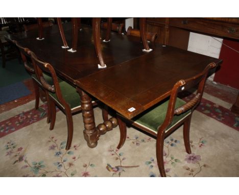 An oak draw leaf refectory table raised on bobbin turned supports. 128cm or 227 cm long x 100cm wide.