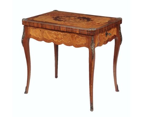 A marquetry and gilt metal mounted card table in Louis XV style, mid 20th century, the marquetry inlaid swivel top with centr