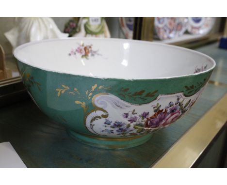 A Continental china bowl, green ground with floral decoration and gilt highlights, 29cm in diameter and a Kruckers Chinese em