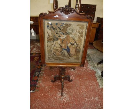 A mid 19th century mahogany firescreen with petit point panel 136cm high, 67cm wide Best Bid