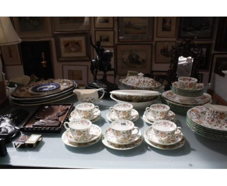 A spelter figure of a King on horseback, a cast iron doorstop, a Minton part tea service, a gilt frame wall mirror, four meat