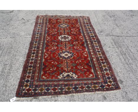 A vintage Caucasian rug 212 x 132cm