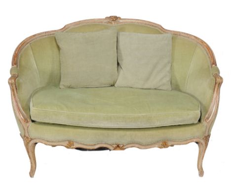 A French Louis XVI style sofa, with carved and curved top rail leading to back and arms, above removable seat cushion and cab