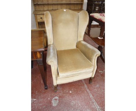 A Georgian style wing back chair on cabriole front supports, a Georgian style mahogany double pedestal dining table,178cm x 1