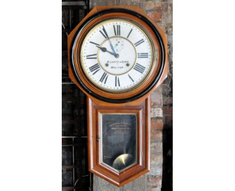 An American drop dial Wall Clock by the Ansonia Clock Company, the dial inscribed 'B Leefe & Sons, Malton'. 
