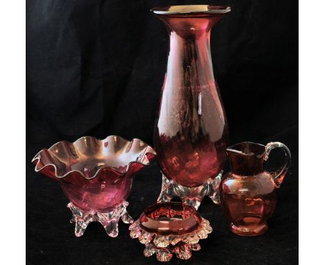 A Cranberry glass baluster Vase on lappet feet, 11" (28cms) high, a Cranberry glass bowl with crimped rim and two other items