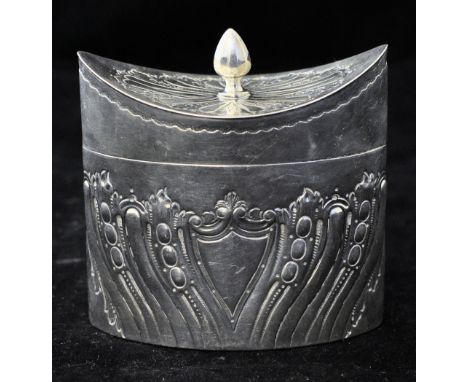 A late Victorian silver navette shape Tea Caddy with hinged cover, acorn knop and embossed decoration with a vacant shield sh