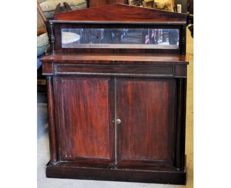 A mid 19th Century mahogany Chiffonier, the raised back with an open shelf and mirror panel, raised on slender turned support