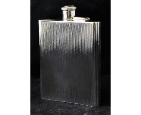 An engine turned silver Hip Flask, 5" (13cms) high, Birmingham 1940, maker: Thomas Ducrow & Sons, 7.2oz. 