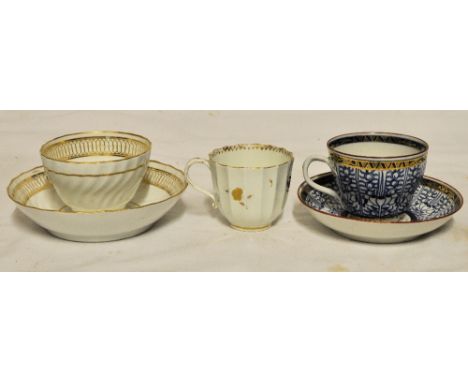A First Period Worcester Tea Cup and Saucer decorated with the Royal Lily pattern in blue and gilt and with crescent mark to 