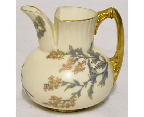 A Royal Worcester baluster Jug with gilded handle, decorated with sprays of flowers on an ivory ground.  3 1/2" (9cms) high. 