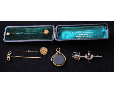 A 9ct gold Stick Pin, another set with a seed pearl, two other Stick Pins, etc. 