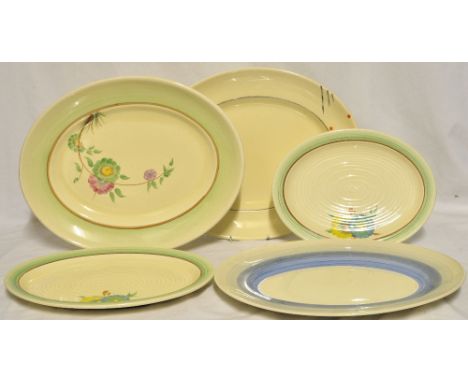 A Newport pottery Clarice Cliff oval Meat Plate painted with a spray of flowers, a pair of Wilkinson graduated oval meat plat