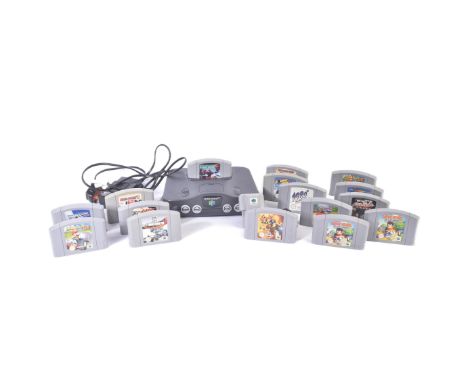 Retro Gaming - a vintage N64 Nintendo 64 video game console with a selection of games and rumble pak, expansion pak inside. G