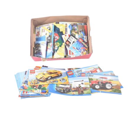 A large collection of assorted vintage Lego instruction manuals to include; Creator, City, Space, Toy Story, Aqua Raiders, At