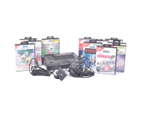 Retro Gaming - a vintage Sega Master System II console with controllers and x11 gaming cartridges comprising; Jurassic Park, 