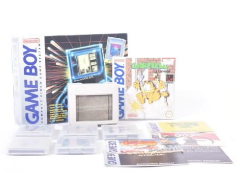 Retro Gaming - a vintage 1980s (1989) boxed Nintendo handheld video game console model No. DMG-01 with a selection of games a