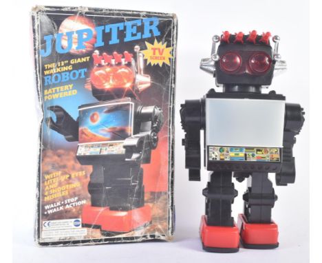 A vintage battery operated ' Jupiter ' robot with light up eyes, central TV screen, missile shooting action and and walk / st