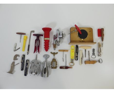 21 Assorted Corkscrews, Bottle Openers, An Optic and A Silver and Mother of Pearl Fruit Knife