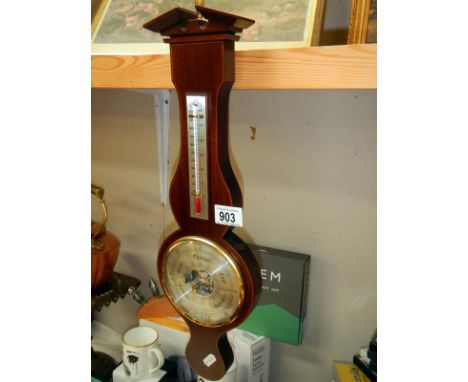 A wall hanging barometer