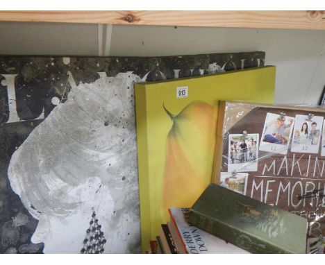 A quantity of canvas prints and a photo clock.
