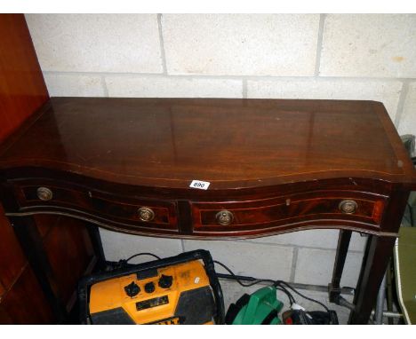 A bow front mahogany string inlaid hall table with 2 drawers