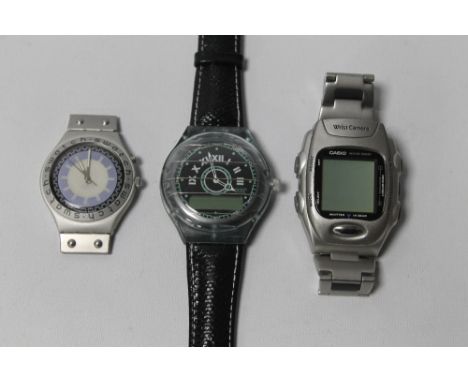 A SWATCH IRONY GENTS WRIST WATCH (NO STRAP), a Swatch gents wrist watch with original strap and a vintage Casio wrist camera 