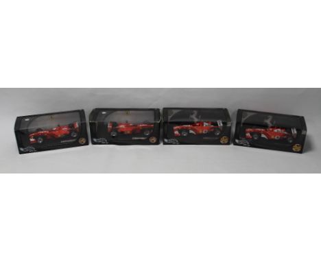 FOUR BOXED HOTWHEELS MICHAEL SCHUMACHER 1:18 SCALE FERRARI F1 CARS, to include F 2001 x2, Melbourne 2002 and Premier edition 
