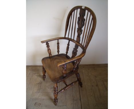 Elm stick back Windsor armchair on turned supports and H shaped under stretcher  