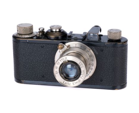 A Leica Ic Camera, 1931, black/nickel, serial no. 64937, with Leitz Elmar f/3.5 50mm lens, nickel, body, F-G, shutter working