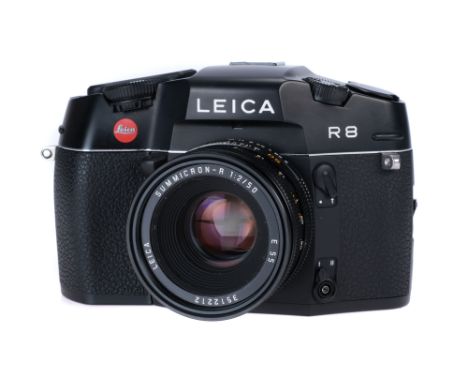 A Leica R8 SLR Camera, 1997, black, serial no. 2430127, with Leitz Summicron f/2 50mm lens, black, serial number , 3512212, b