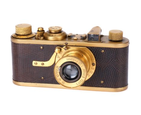 A Leica I Model A 'Luxus' Replica Camera, 1930, gold, serial no. 34814, with Leitz Elmar f/3.5 50mm lens, gold, body, VG, shu