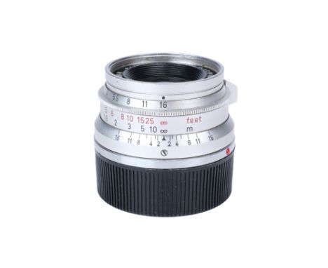 A Leitz Summicron f/2 35mm Lens, 1965, chrome, serial no. 2133785, body, F, elements, F-G, some fungal marks to center of mid