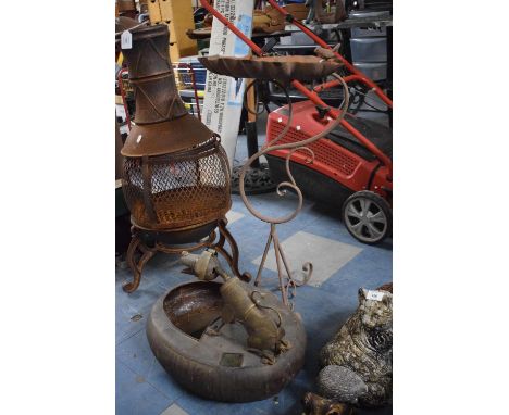A Wrought Iron Bird Bath on Tripod Stand in the Form of a Leaf and a Metal Novelty Stand with Dog 