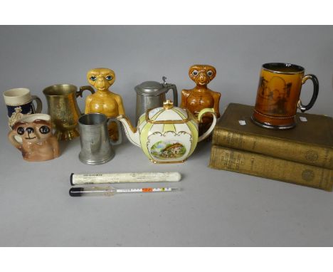 A Tray Containing Three Ceramic ET Ornaments, Pewter Silver Plated Tankards, Two Encyclopedia, Hydrometer and Teapot 