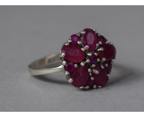 A White Metal and Ruby Cluster Ring, Stamped but Illegible 