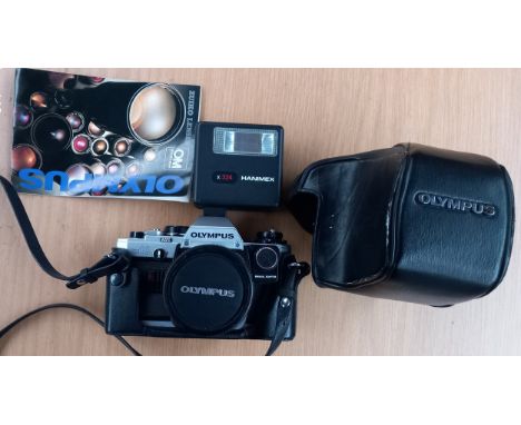 Olympus om 10 camera with original case and manual, in working condition.