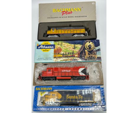 Three boxed train models; Bachmann Union Pacific 749, Athearn 5004 CP Rail and Bachmann Santa Fe 3501 model