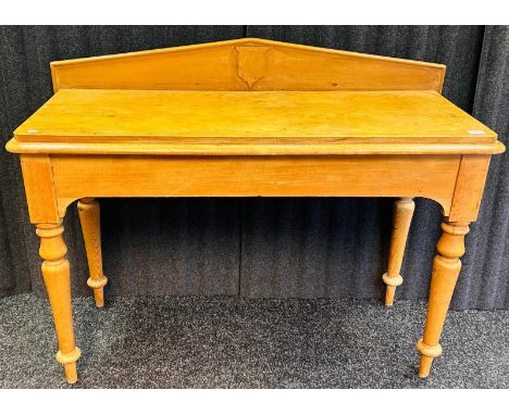 Farmhouse pine console, the back rail above a shaped rectangular top, raised on turned tapered legs [96x121x48cm]