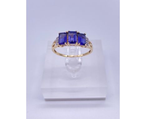 9ct gold ladies ring, three square cut amethyst stones Size: P/QWeight: 1.95g